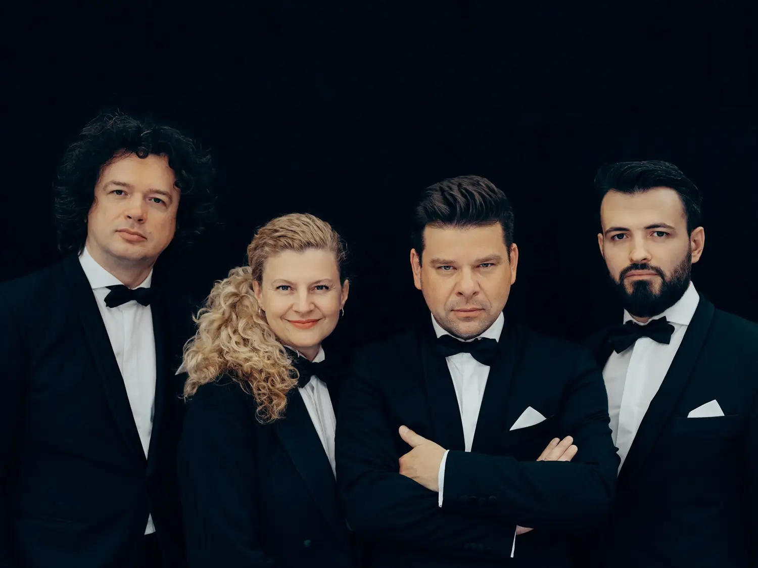 Porträtfoto des Pavel Haas Quartet mit vier Personen.